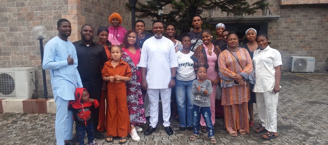 Members of TRPC Lagos, adults and children, gathered outside after a service
